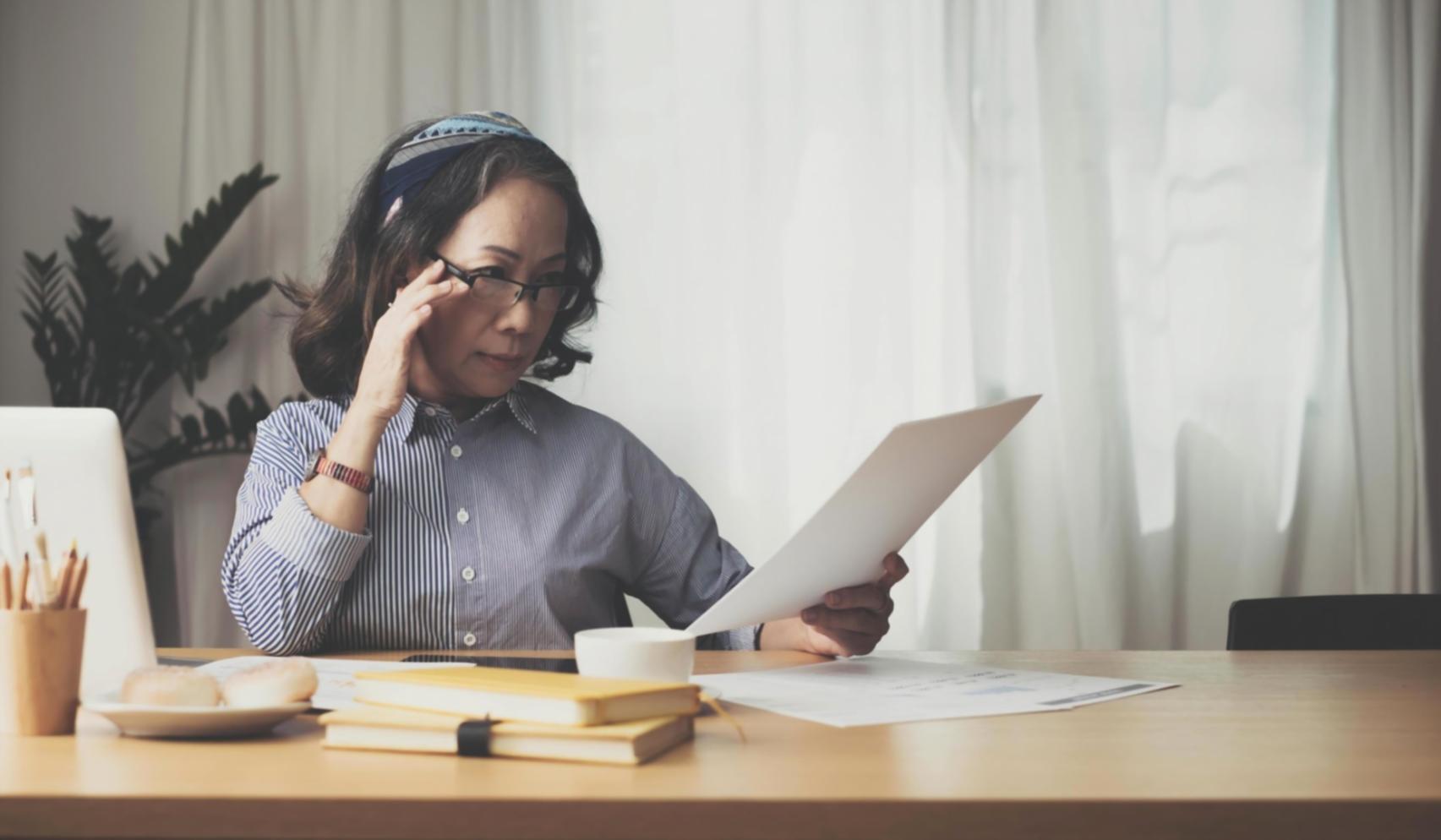 Business professionals reviewing negotiation documents